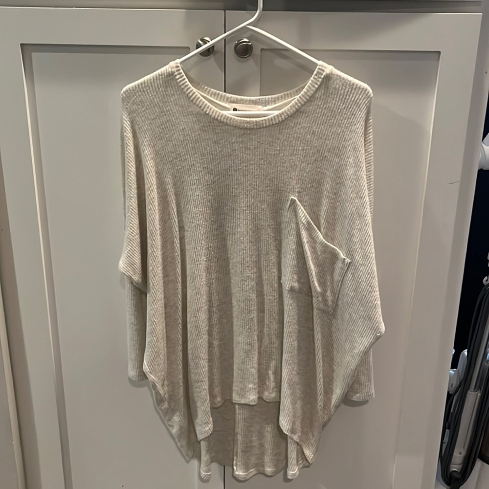 The impeccable, pig light long flowing sweater